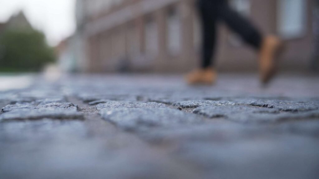 a pedestrian walking down the road